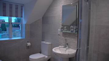 Bathtub, hair dryer, towels, soap
