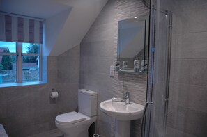 Bathtub, hair dryer, towels, soap