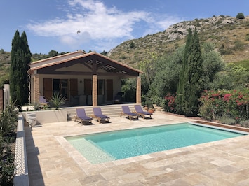 Secluded villa with private pool, south facing natural travertine terrace.