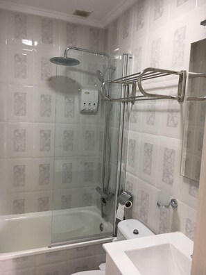 Combined shower/tub, hair dryer, towels, toilet paper