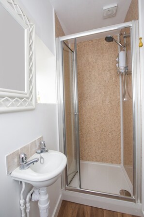 Bathtub, hair dryer, towels, soap