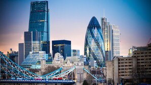 A cityscape with modern skyscrapers, a historic building, and a bridge. - PRIVATE APARTMENT - HEART OF SHOREDITCH (London)