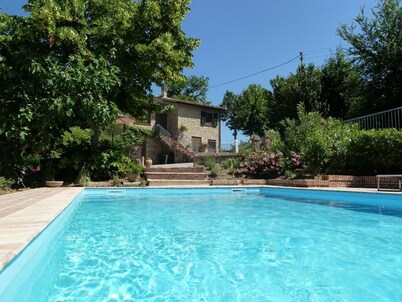Idyllic character cottage set in landscaped garden with a private pool