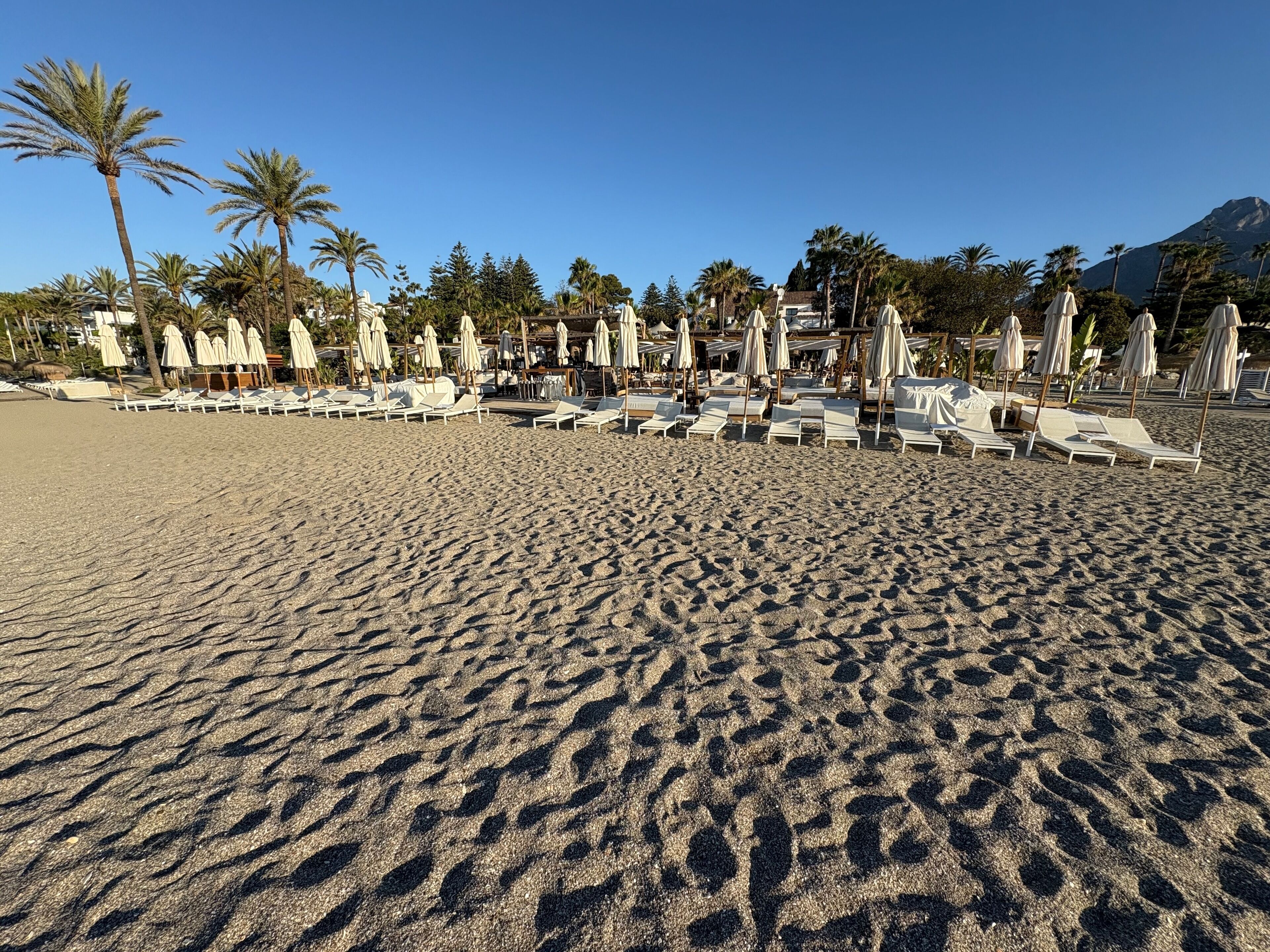 On the beach, sun-loungers, beach towels