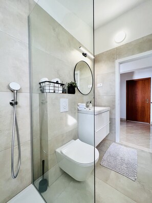 Shower, hair dryer, towels, soap