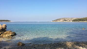 On the beach, sun-loungers