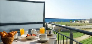 Enjoy a peaceful breakfast on the balcony with a stunning sea view.