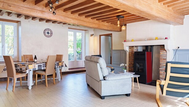 A spacious living area with a fireplace, a dining table with chairs, and a sofa. - Mansion (Saint-Germain-Des-Champs)