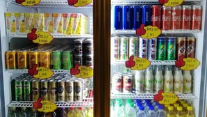 A refrigerated display case with various beverages and snacks. - Tambun Warm Hotel (Ipoh)