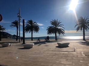 On the beach, sun-loungers