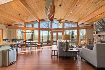 Open living area with floor to ceiling windows overlooking Kentucky Lake.