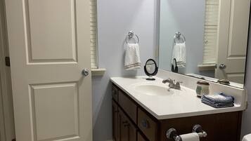 Combined shower/tub, hair dryer, towels, soap