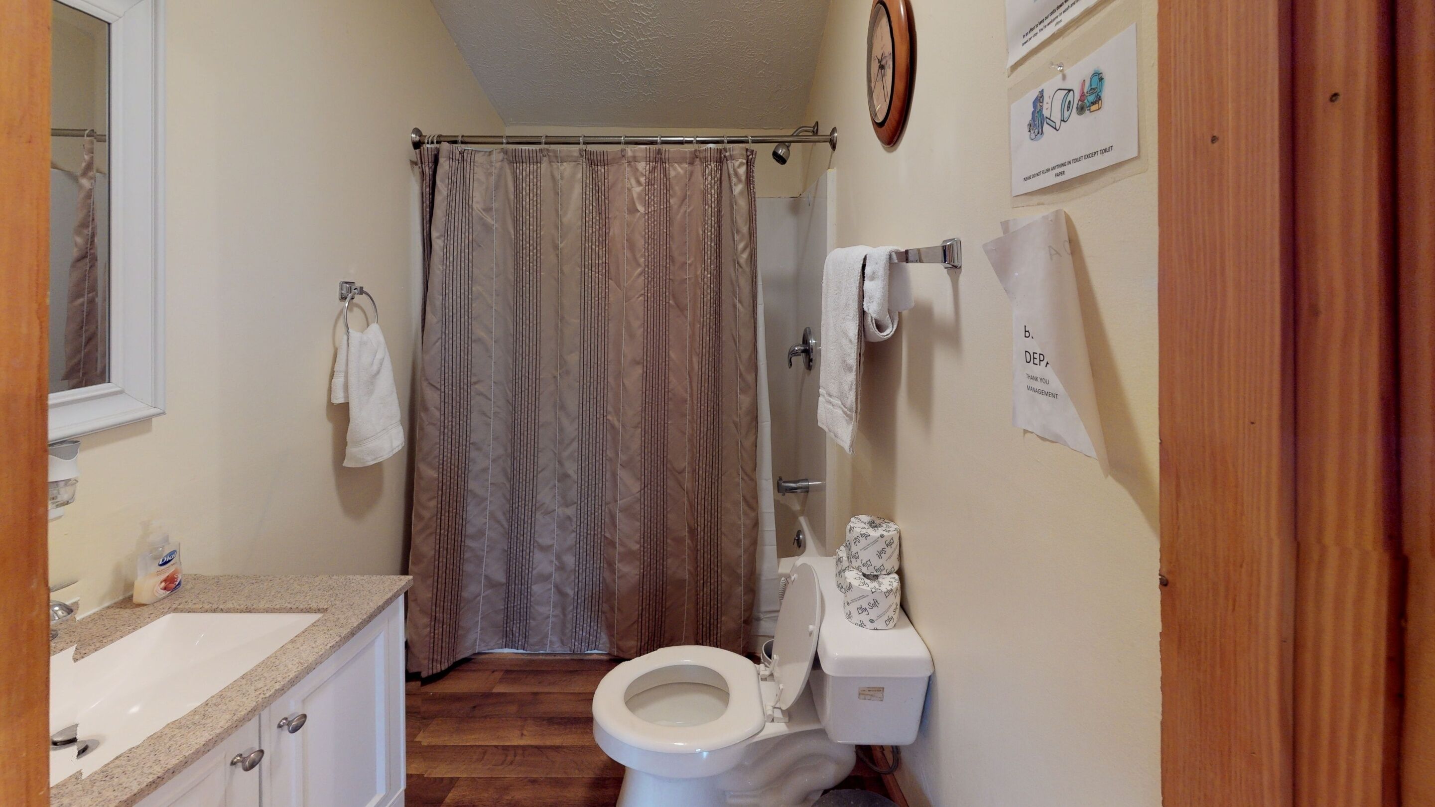 Combined shower/tub, towels, soap, toilet paper