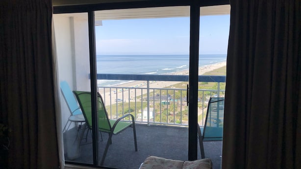 A balcony with a view of the beach and ocean. - GORGEOUS View of Ocean, Coast & Sunset! - Remodeled Forest Dunes (Myrtle Beach)