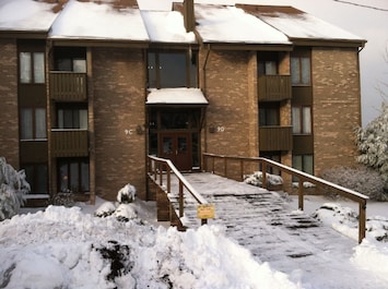 Winter view of the front entrance to the condo from the parking lot.