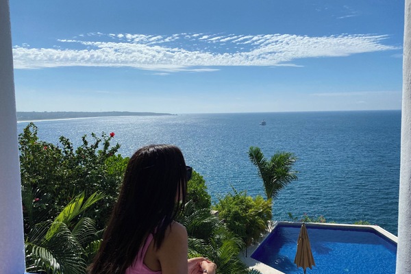 Pacific ocean view from balcony, and the infinity pool in front.