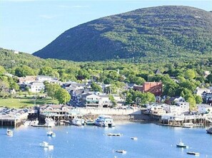 Stunning coastal town with a picturesque harbor and lush surroundings.