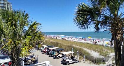 One minute drive to beach with golfcart! Updated, beach decor & clean!