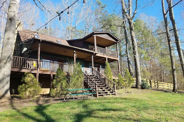 spacious log cabin on 3+ acres with river access on property