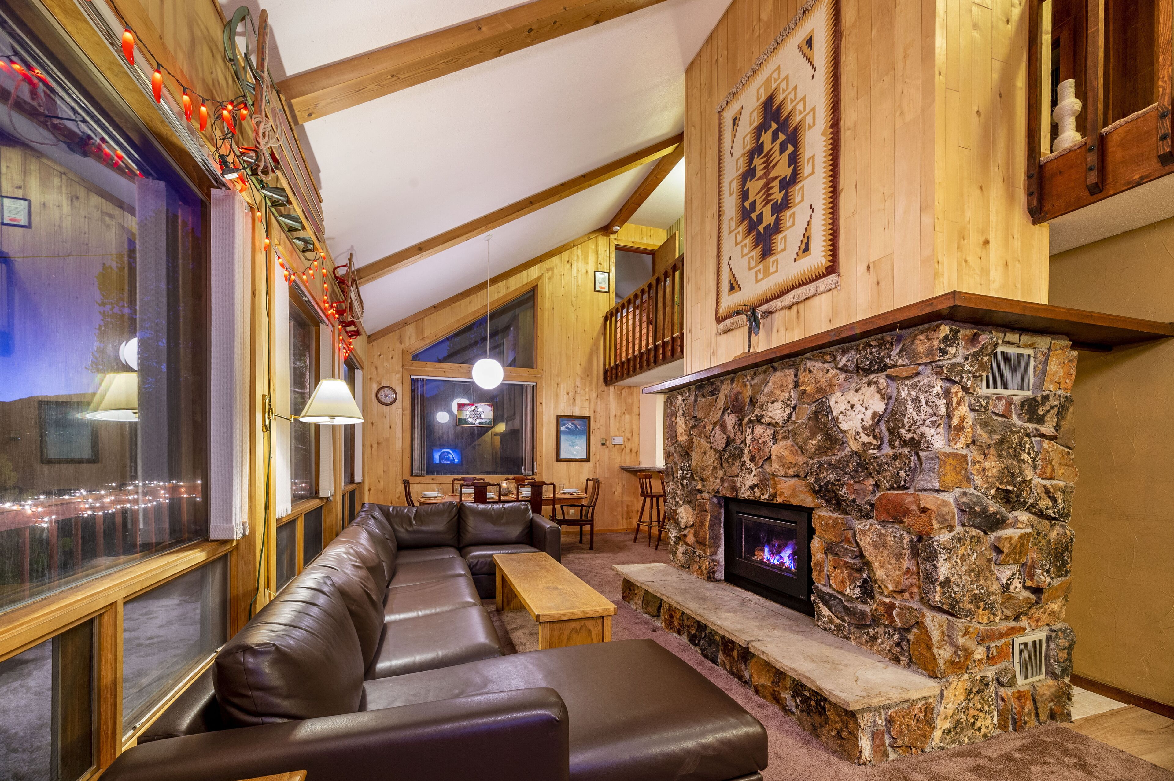 Living Room with six piece sectional and chaise set facing gas fireplace