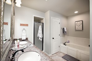 Combined shower/tub, hair dryer, towels, soap
