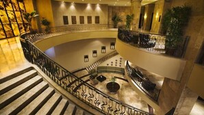 A multi-level interior with a curved staircase, marble flooring, and decorative lighting. - A View from the Top!  Las Palomas Penthouse Level Beachfront Luxury Condo!!! (Puerto Penasco)