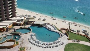 A resort with multiple swimming pools, a beach, and a view of the ocean. - A View from the Top!  Las Palomas Penthouse Level Beachfront Luxury Condo!!! (Puerto Penasco)