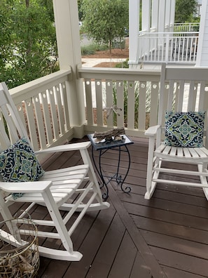 Relax on the deck with two comfortable rocking chairs and a small table.