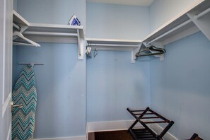 A room with a blue wall, a wooden bench, and a white shelf with a hanging iron. - 6-Seater Golf Cart & 6 Bikes! Spacious Porches! Balconies w/ Views of the Pond! Latitude Adjustment (Santa Rosa Beach)