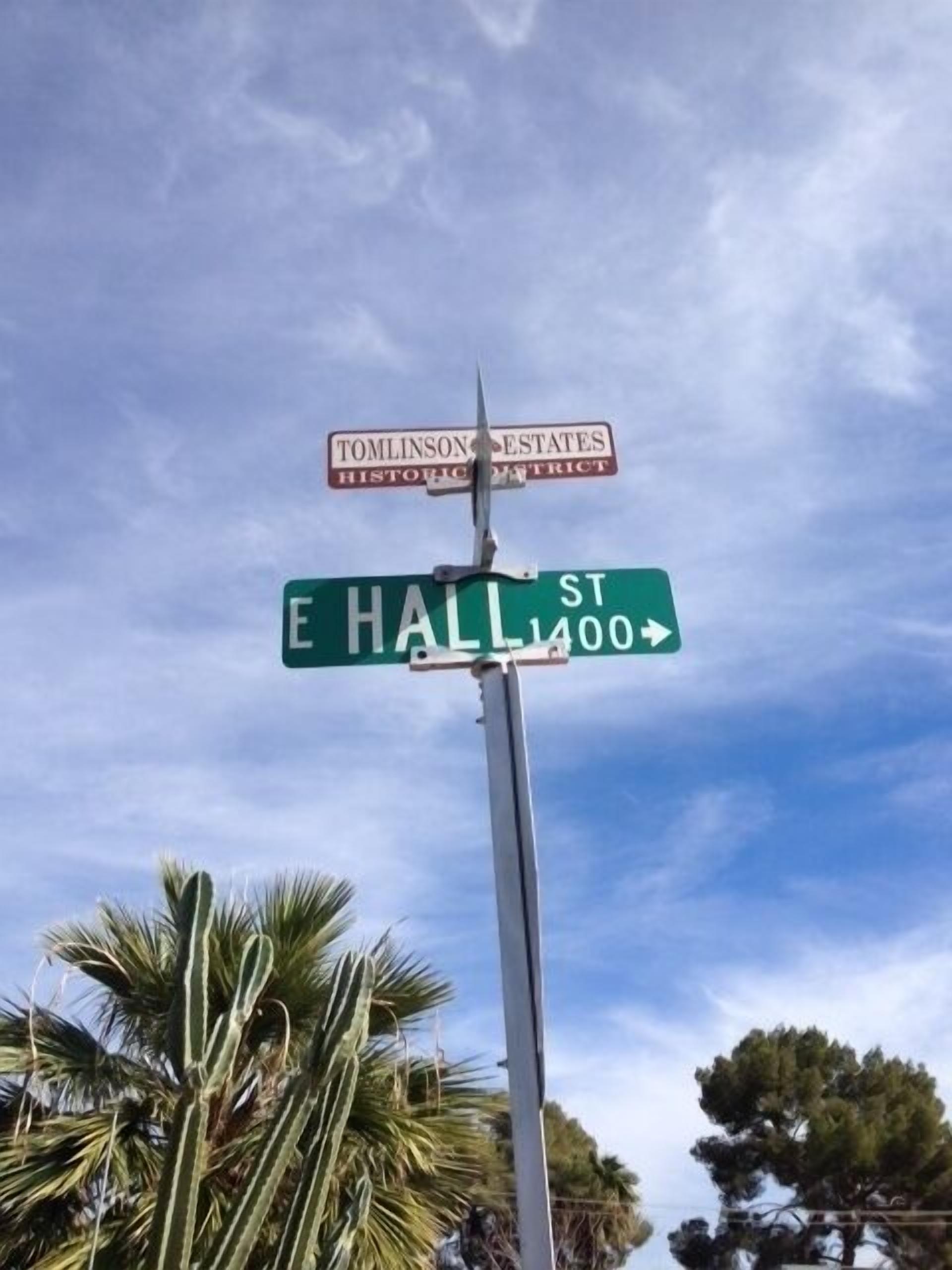 Street signs for Tomlinson Estates Historic District and E Hall St.