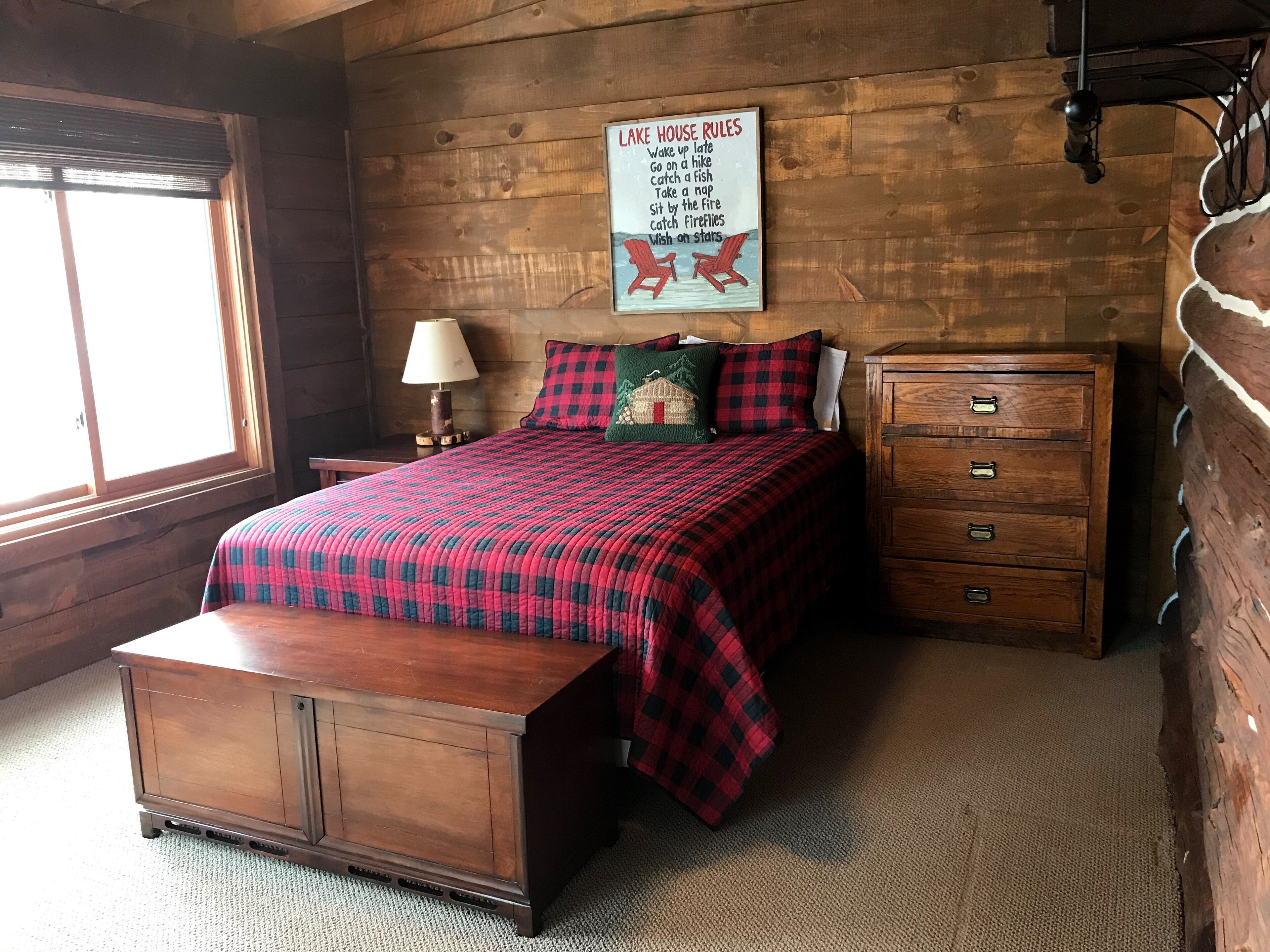 Log cabin on 19 mile Long Lake, large screen porch + dock, within mature pines