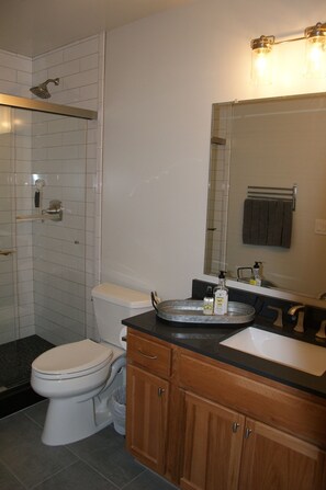 A bathroom with a shower, toilet, sink, and vanity. - Luxury 2 Bedroom, 2 Bath Condo - Perfect for a Fun Filled Family Get Away! (Mammoth Lakes)