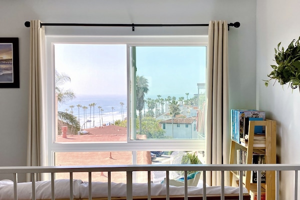 Look out to the Strands beach at Dana Point from the comfort of a daybed