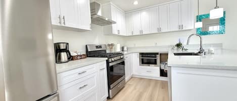 Coffee/tea maker, fridge, microwave, oven