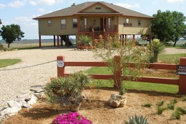 All new landscaping noticeable only upon arrival. Then deck will steal the show!