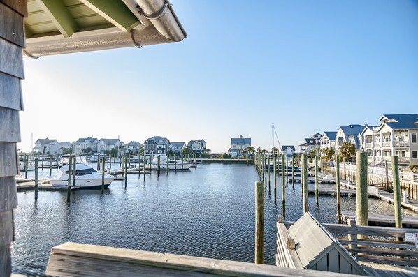 A marina with docked boats and waterfront houses.