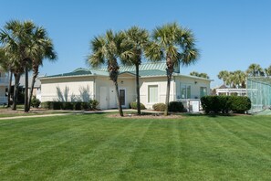 A two-story house with a green roof, surrounded by well-maintained grass and palm trees. - Pets (dogs)Welcome *  Sea 4 Miles*  Sea 4 Yourself* Maravilla 2301 (Destin)