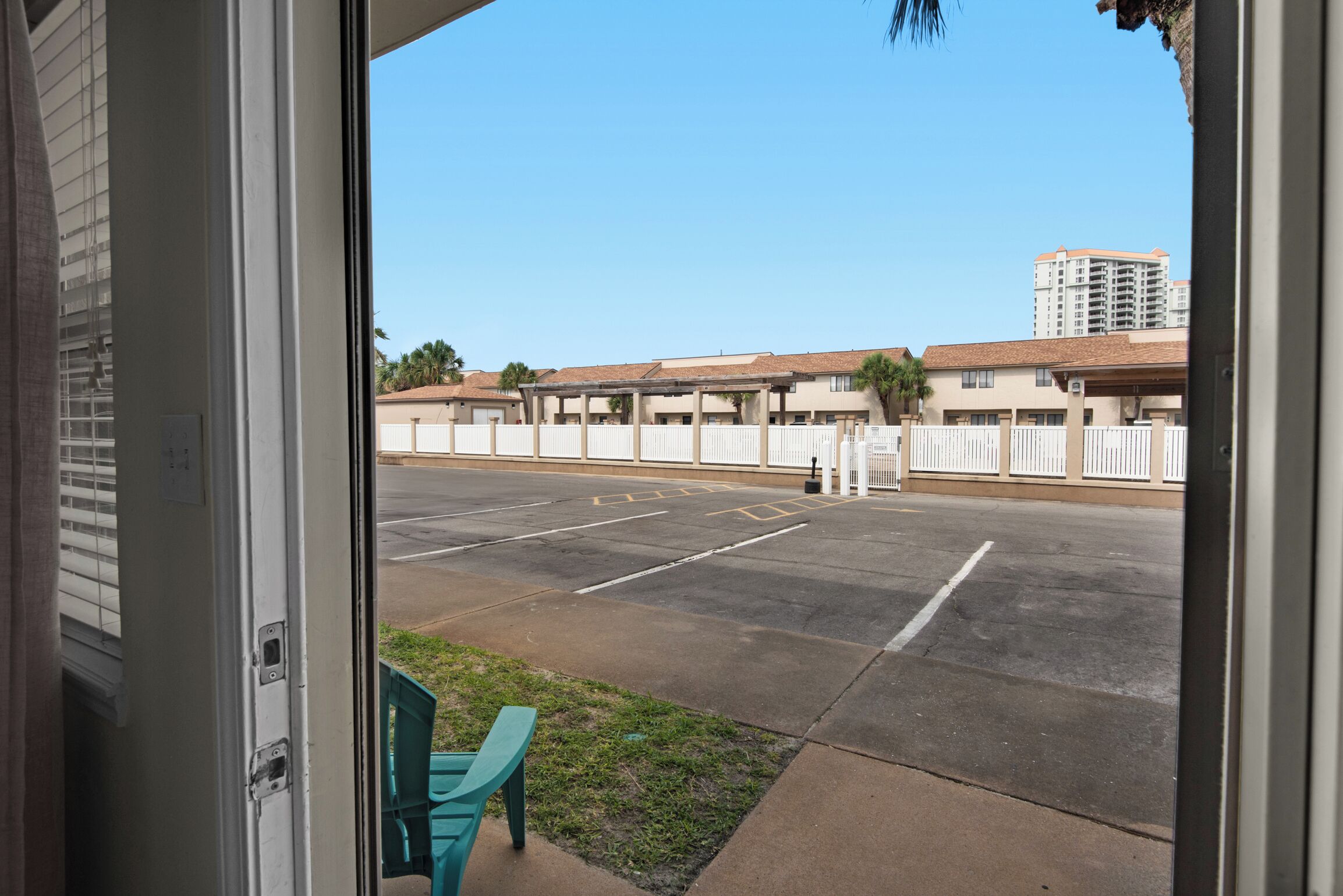 A parking lot with a building in the background.