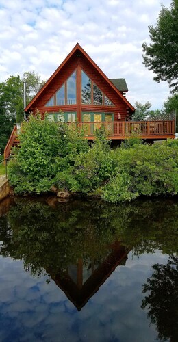 Rent a log home on a private peninsula on Northwood Lake. Enjoy Paradise!
