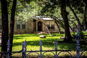 Surrounded by lush greenery, this serene garden setting offers a peaceful retreat.