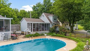 A residential area with a swimming pool, a covered patio, and a fenced yard. - Pool Side Guest House On Lake Hudson Near Pryor (Adair)