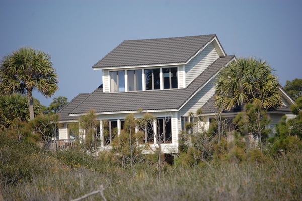 Home over-looks the Gulf and is situated on a private lot with 15 mature palms.