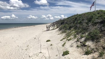 On the beach, sun-loungers