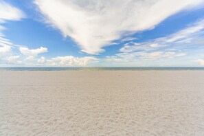 On the beach, sun-loungers, beach towels
