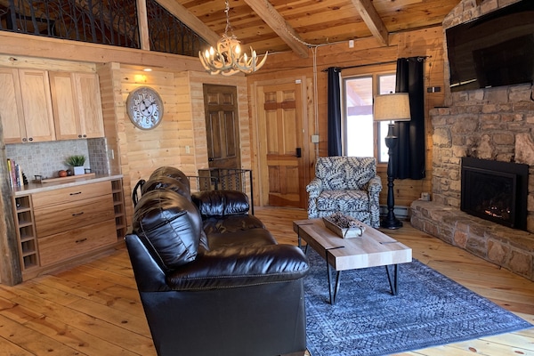 Main Floor Living Area, Gas Fireplace, TV, Deck Access