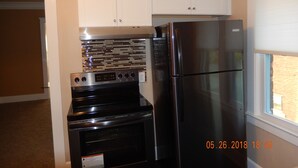 Coffee/tea maker, fridge, microwave, oven - Alexandria's Motor City Condo Apartment (Detroit)