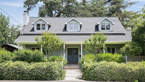 A two-story house with a front porch, a chimney, and a mailbox. - Charming Farm House Downtown St. Helena!  3bedrooms/3baths
Permit # STR26-014 (St Helena)
