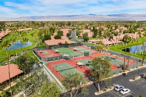 A multi-sport facility with tennis courts, a swimming pool, and a parking area. - Palm Desert - Chapparal (Palm Desert)