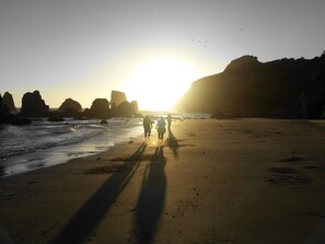 On the beach, sun-loungers, beach towels