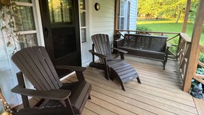 A wooden porch with Adirondack chairs and a bench. - LOCATED IN ABINGDON, VA - PRIVATE, TRANQUIL SETTING (Abingdon)